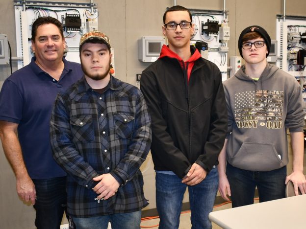 Job shadowing provides hands-on learning for those exploring electrician apprenticeships