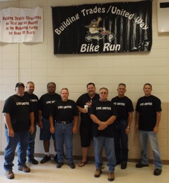 Event organizers, including IBEW Local 64's Jim Burgham (fourth from left), welcomed more than 100 participants in this year's Bike Run.