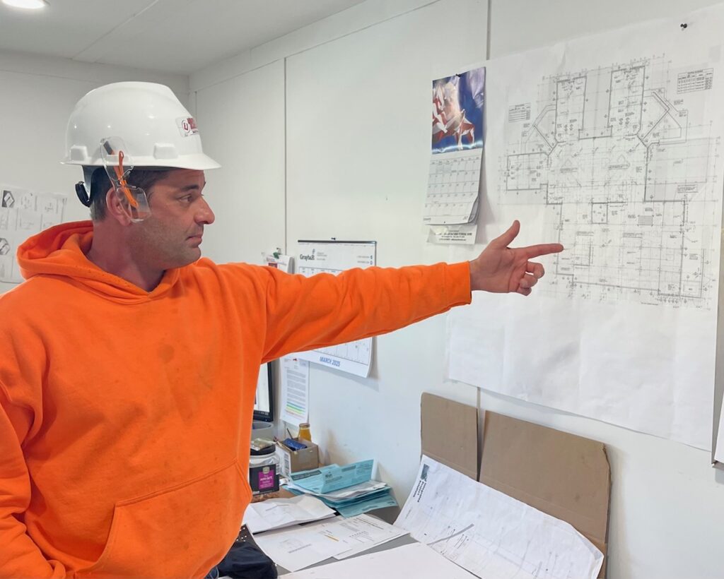 Billy Zarlingo, of University Electric, explaining that the hospital is broken down into four phases of construction.