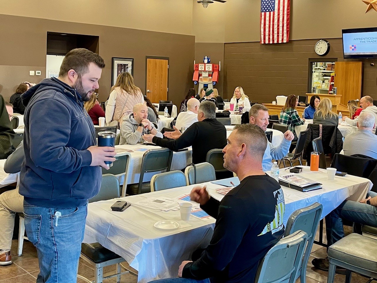 Cody Hilliard and Kenny Lucas, of IBEW Local 64, at guidance counselors presentation about skilled trades.