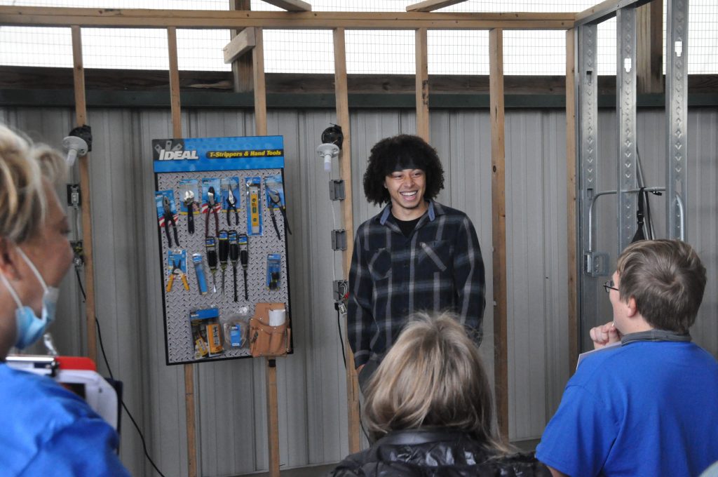 Michon Peterson talks to middle school students about joining trades.