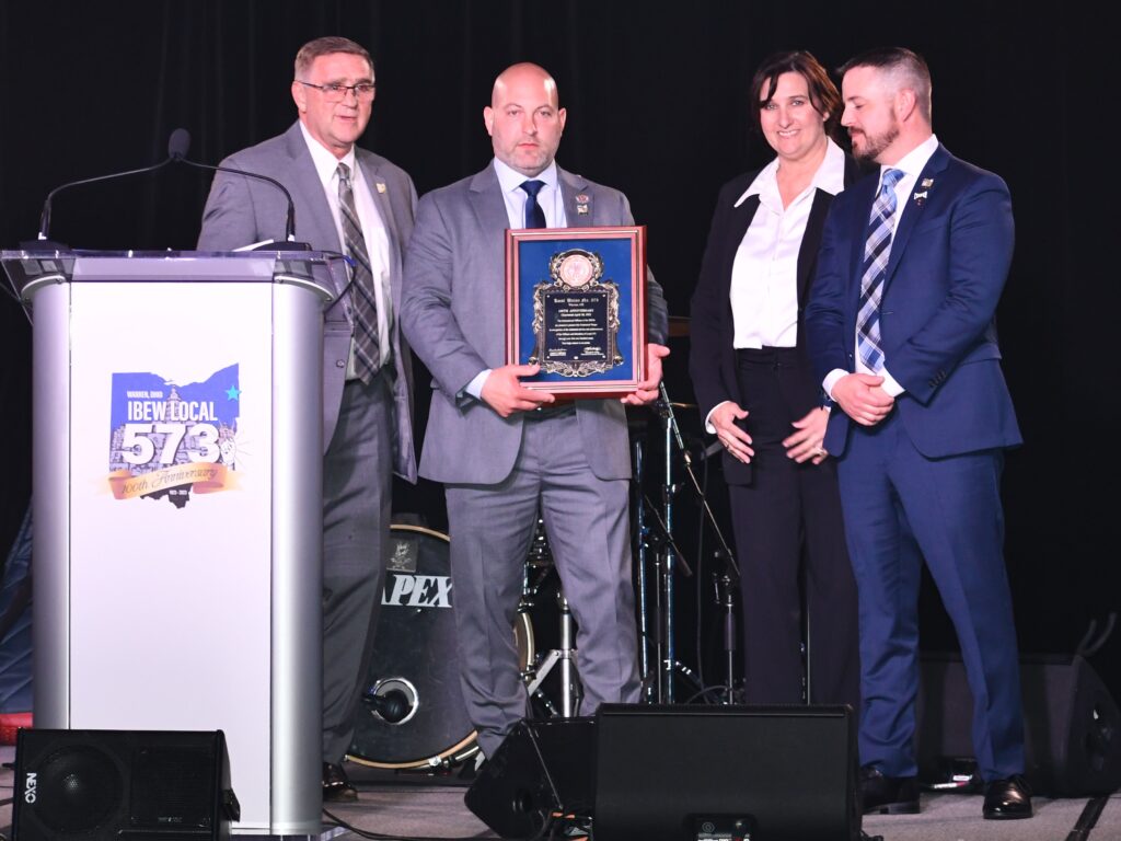 Kenny Cooper presenting commemorative plaque to local leaders