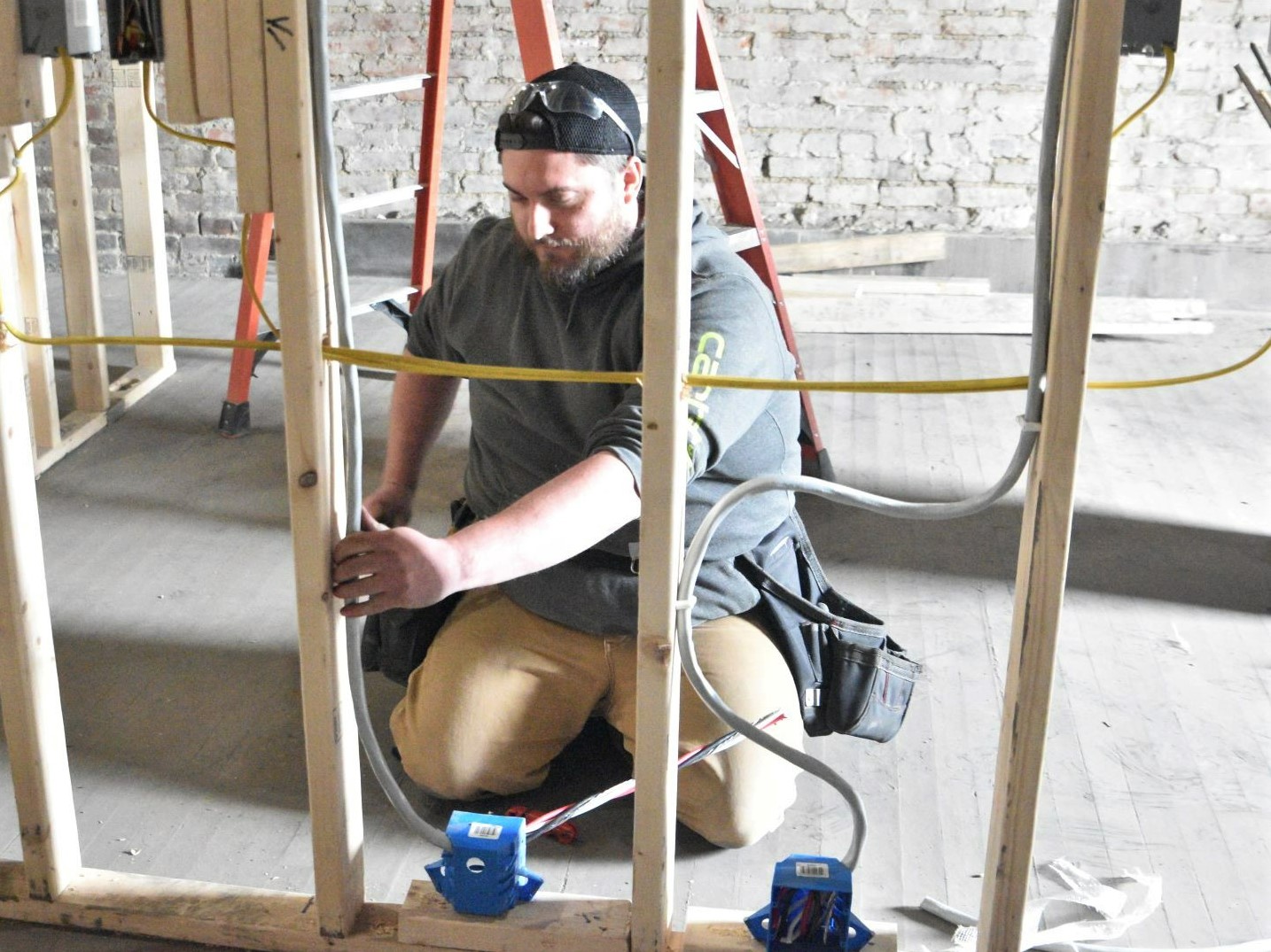 Dustin Ronci installs wire.