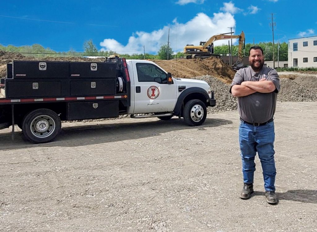 Jason Rubin standing in front of site