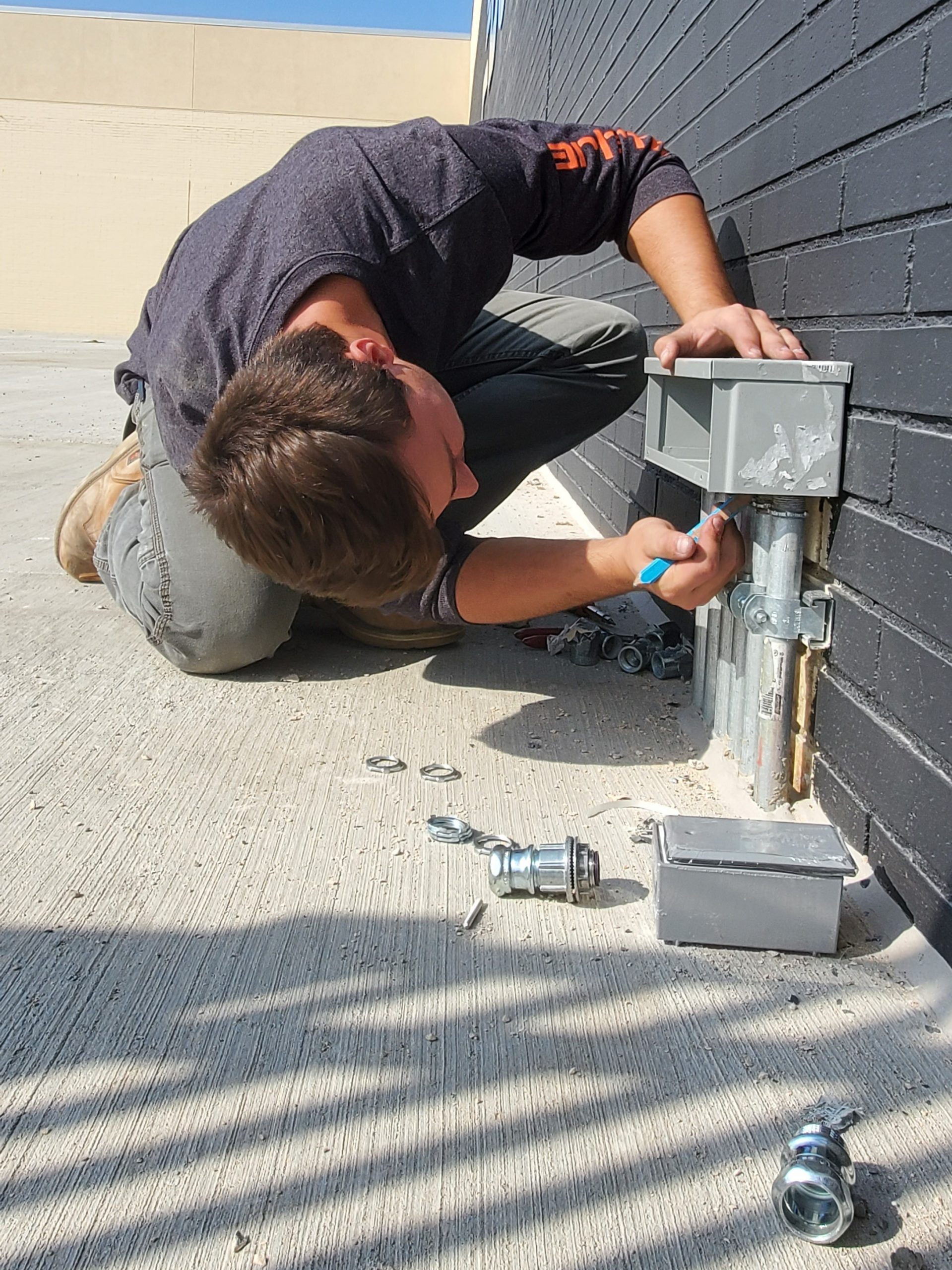 Jeremy Baltes installs electrical components.