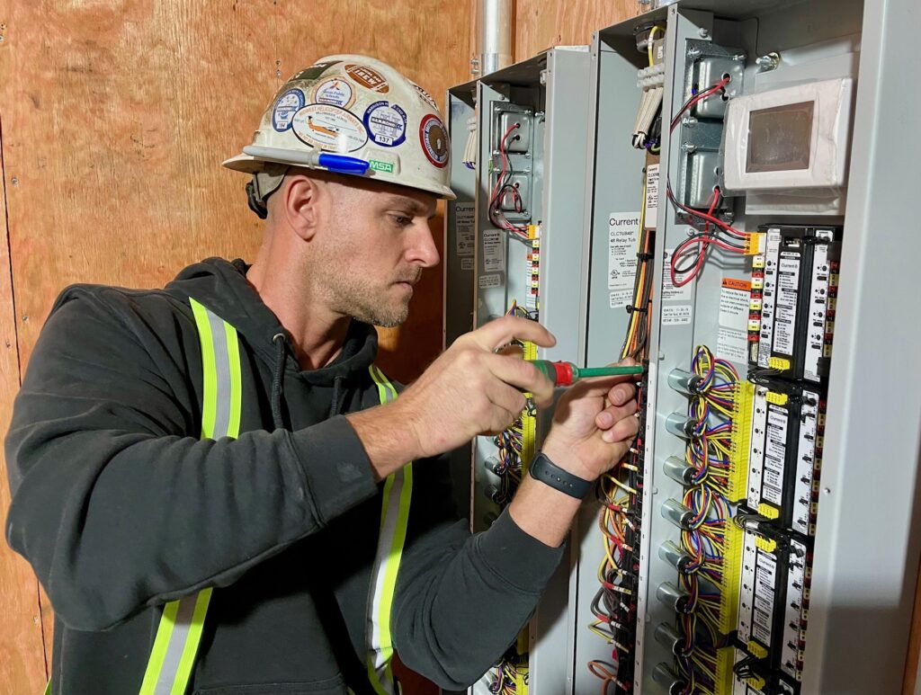 Jeremy Morrow, foreman at Penn-Ohio, working on a lighting panel for the Austintown Meijer store.