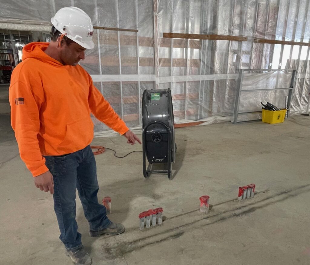 Billy Zarlingo, of University Electric, showing where the electrical feeds come in for the C and D phases of the hospital construction. 