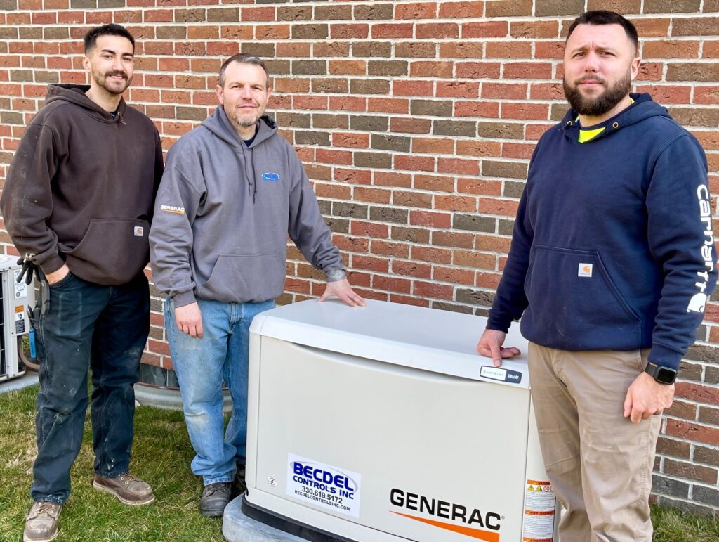 Becdel Controls crew next to generator installed in Warren.