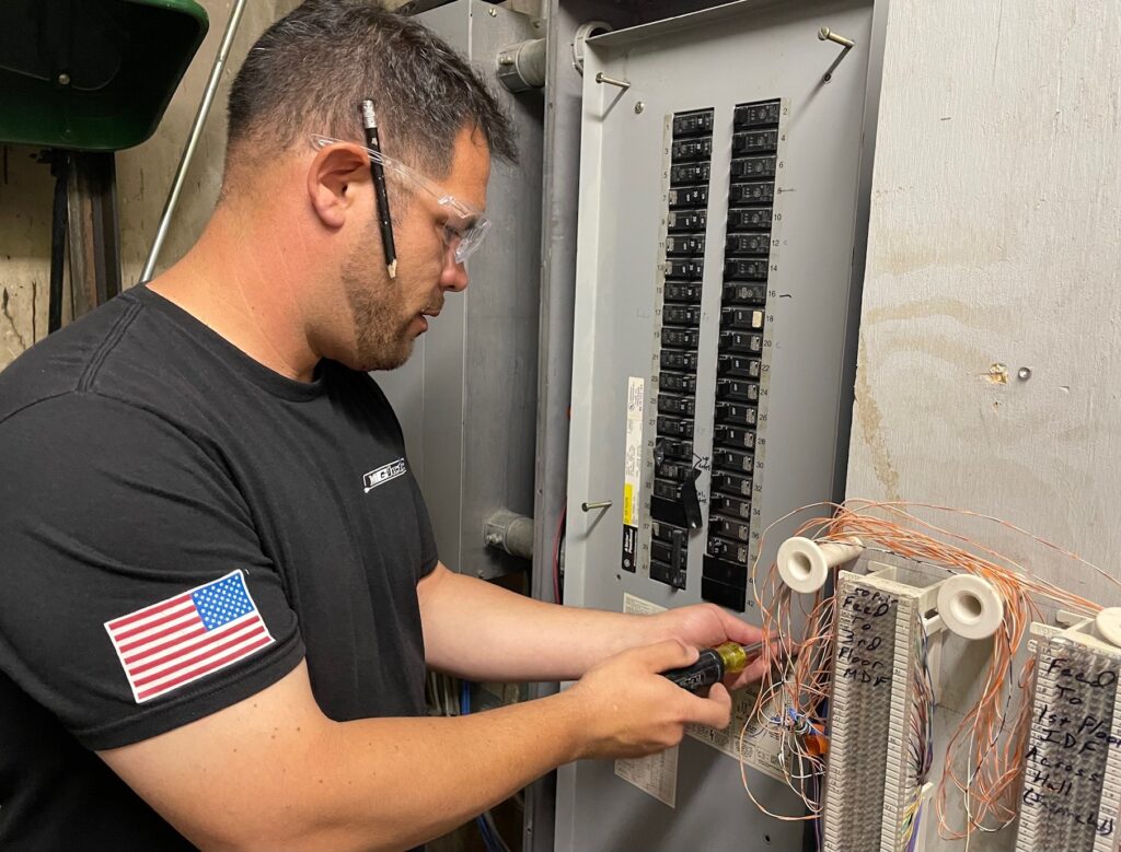Rob Mistovich, foreman at MG Electric, works on the main electrical panel inside the Youngstown Business Incubator. 