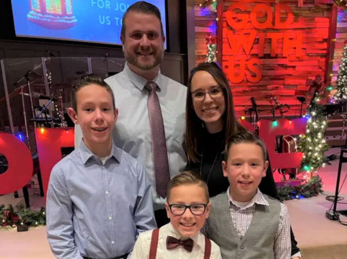 The Berni family stands for a picture.
