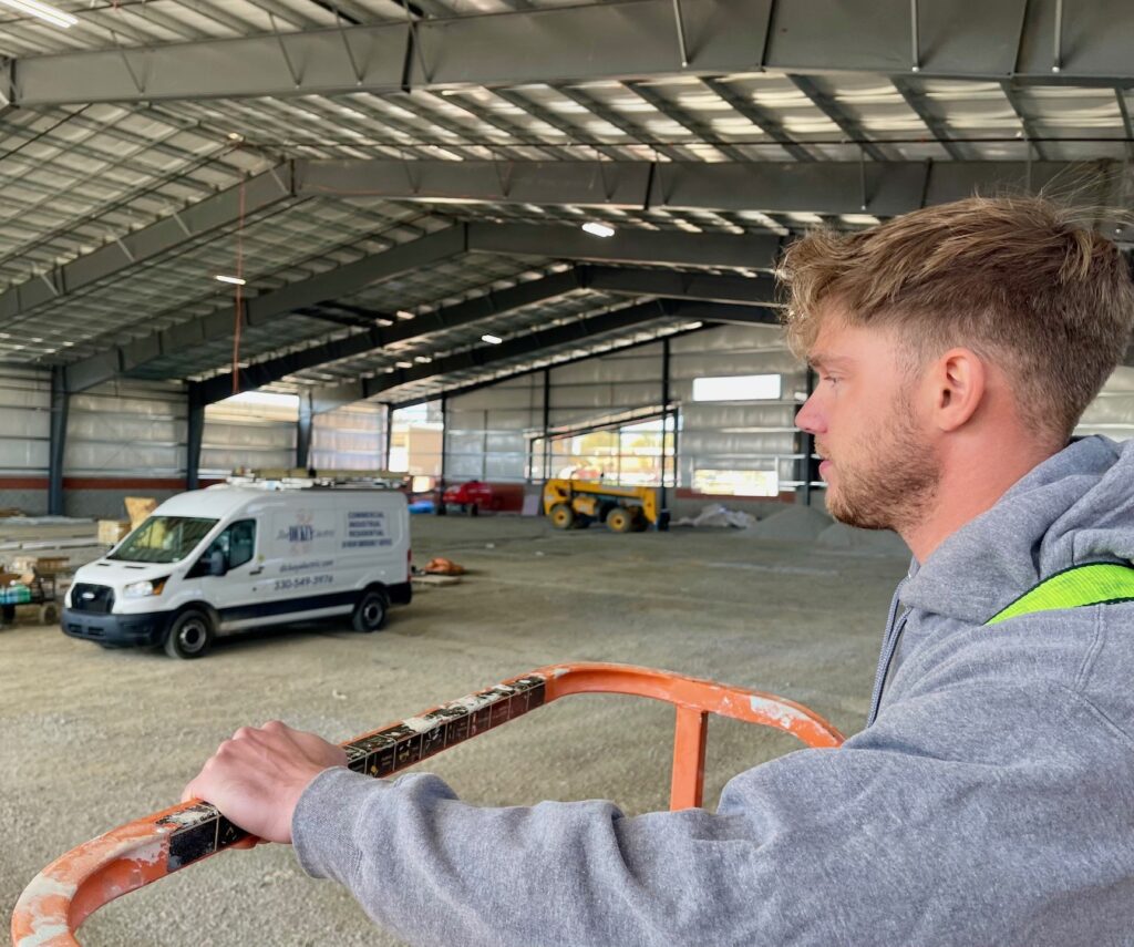 Tom Plummer is two years into his electrician apprenticeship. Part of the duties of the indoor training facility is working the bucket truck.