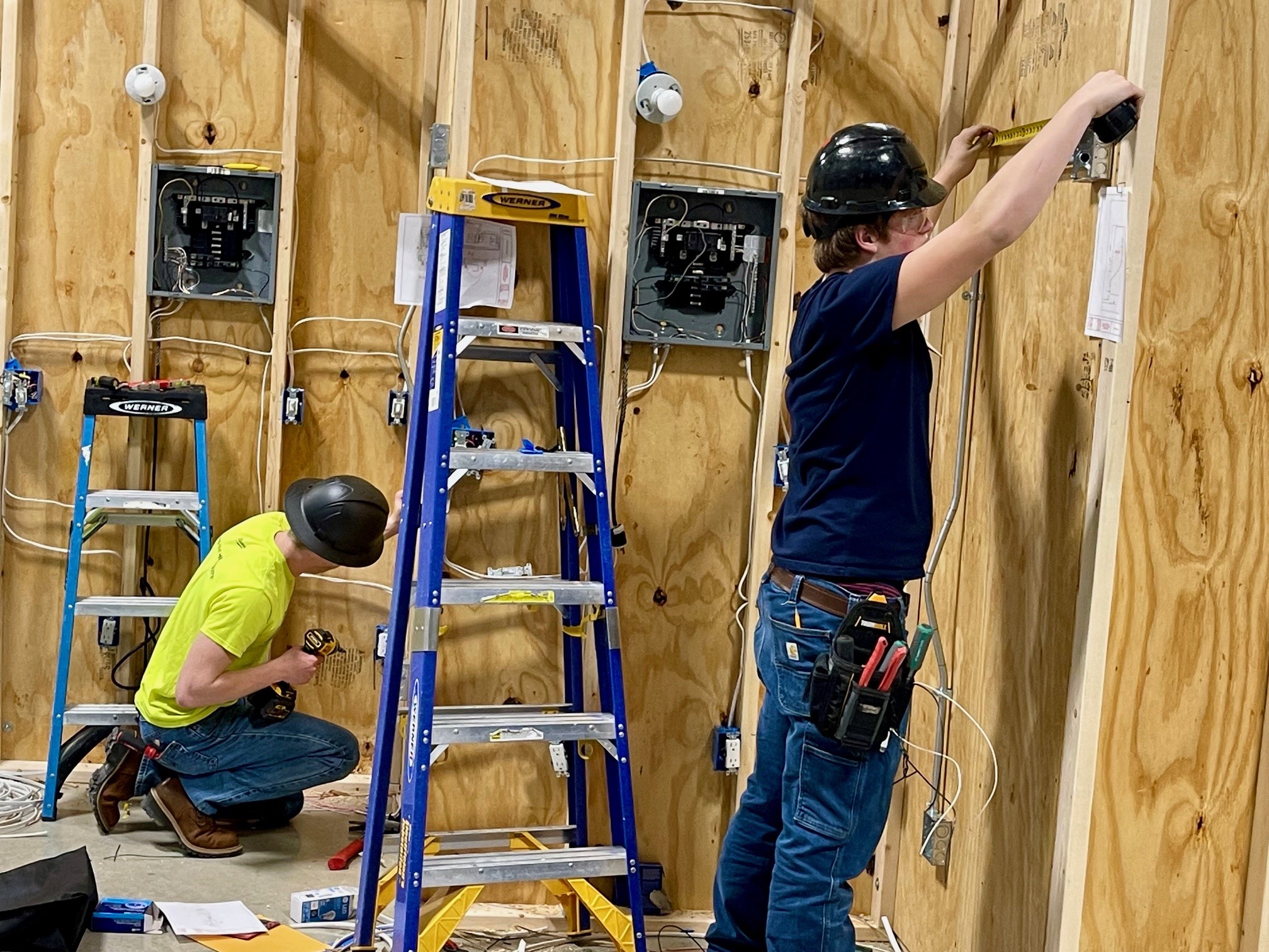 Students at SkillsUSA competition electrical wiring project