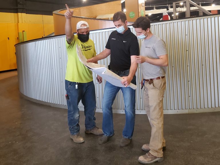 MG Electric electricians looking over blueprints