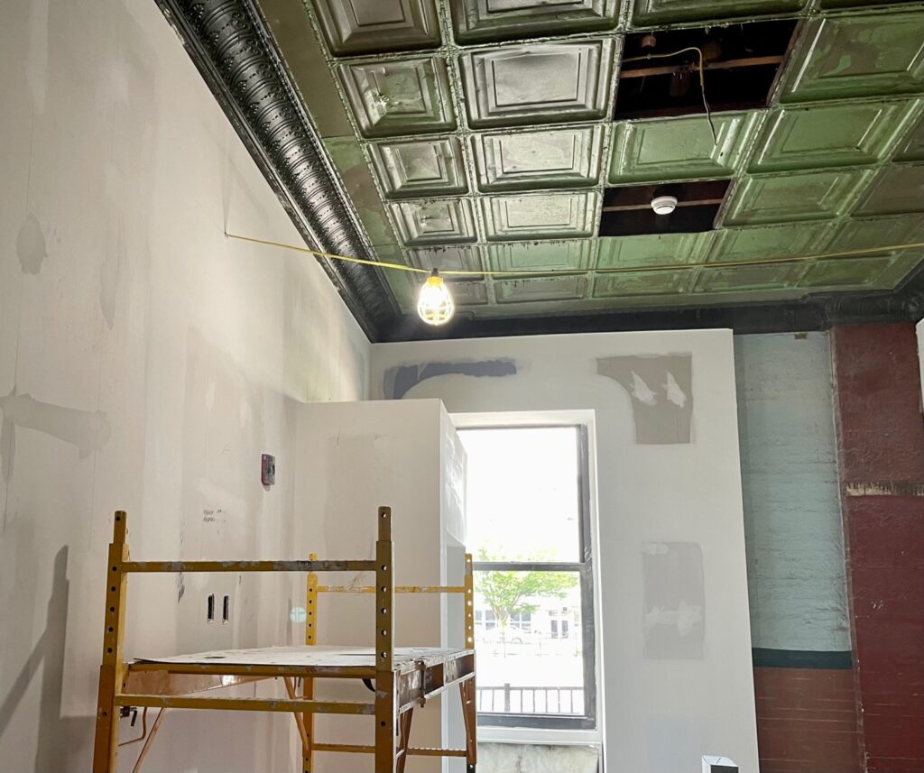 Living unit renovation with tin ceiling