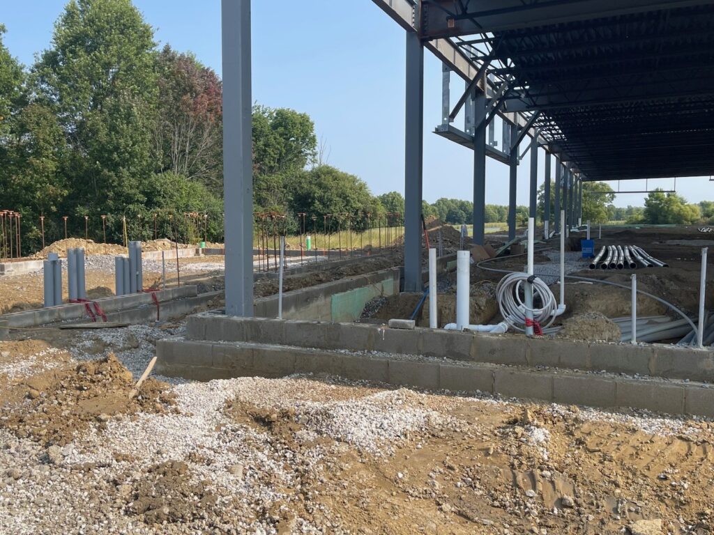 Underground pipe and the area next to building where the transformer and generator will be housed.